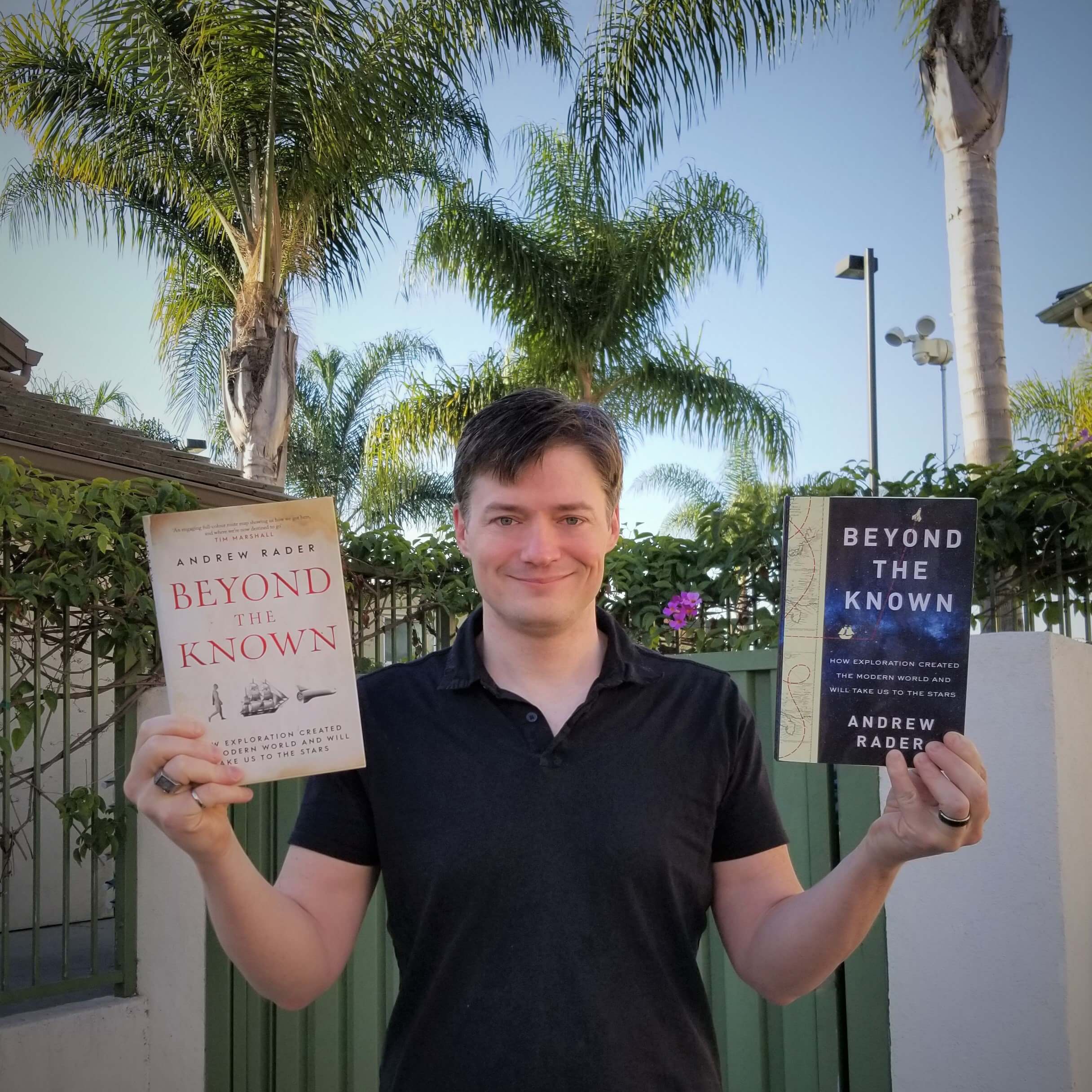 Andrew Rader with his book